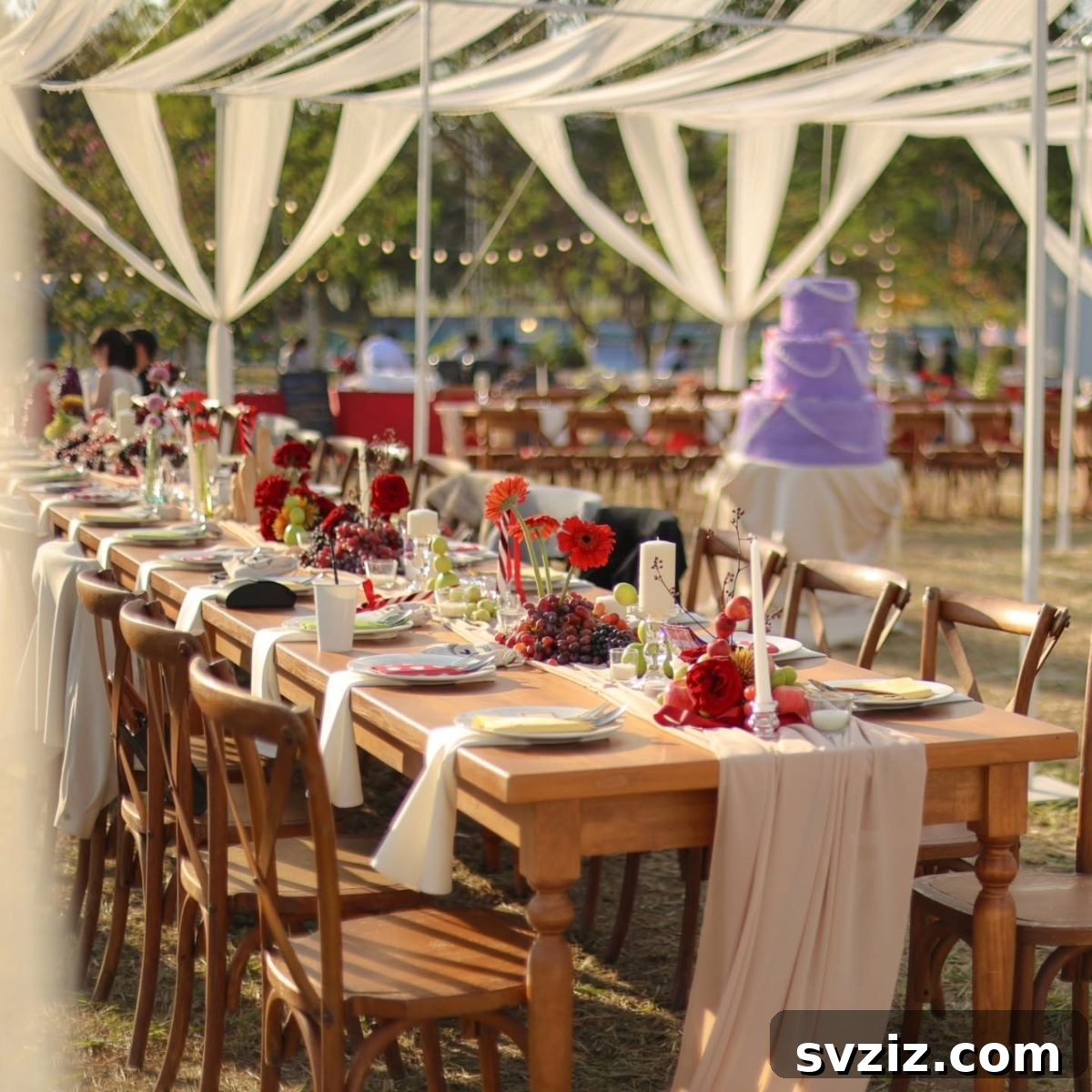 Charming Rustic Long Table Wedding Inspiration 9 Vibrant Red Floral Centerpiece with Grapes on Rustic Outdoor Wedding Table
