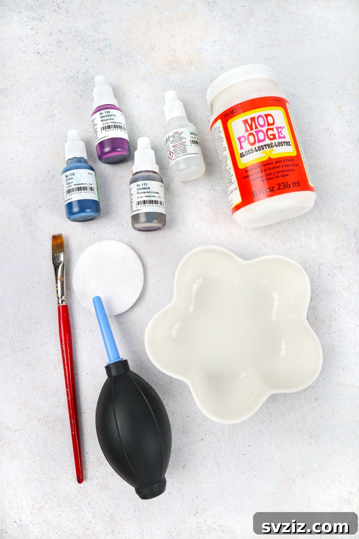 Detailed view of alcohol ink and ceramic bowl supplies