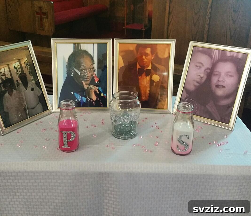 A minimalist wedding memory table featuring framed photos of loved ones and subtle decor.