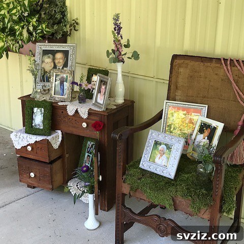 Elegant entry table and chair set decorated with flowers and photos as a wedding memory display.