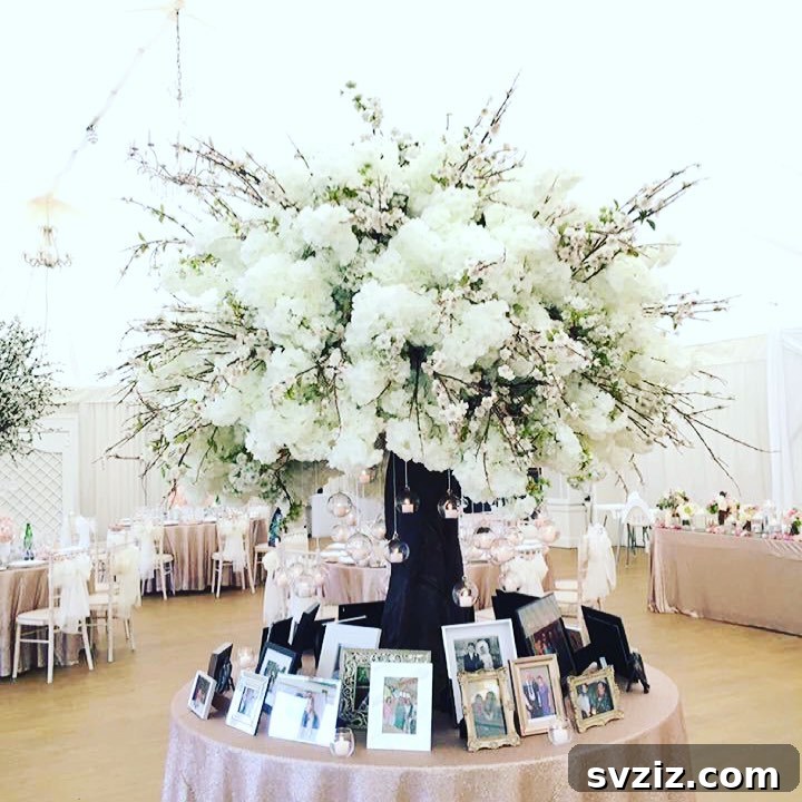 Wedding memory table with prominent, tall floral arrangements surrounding framed photos.