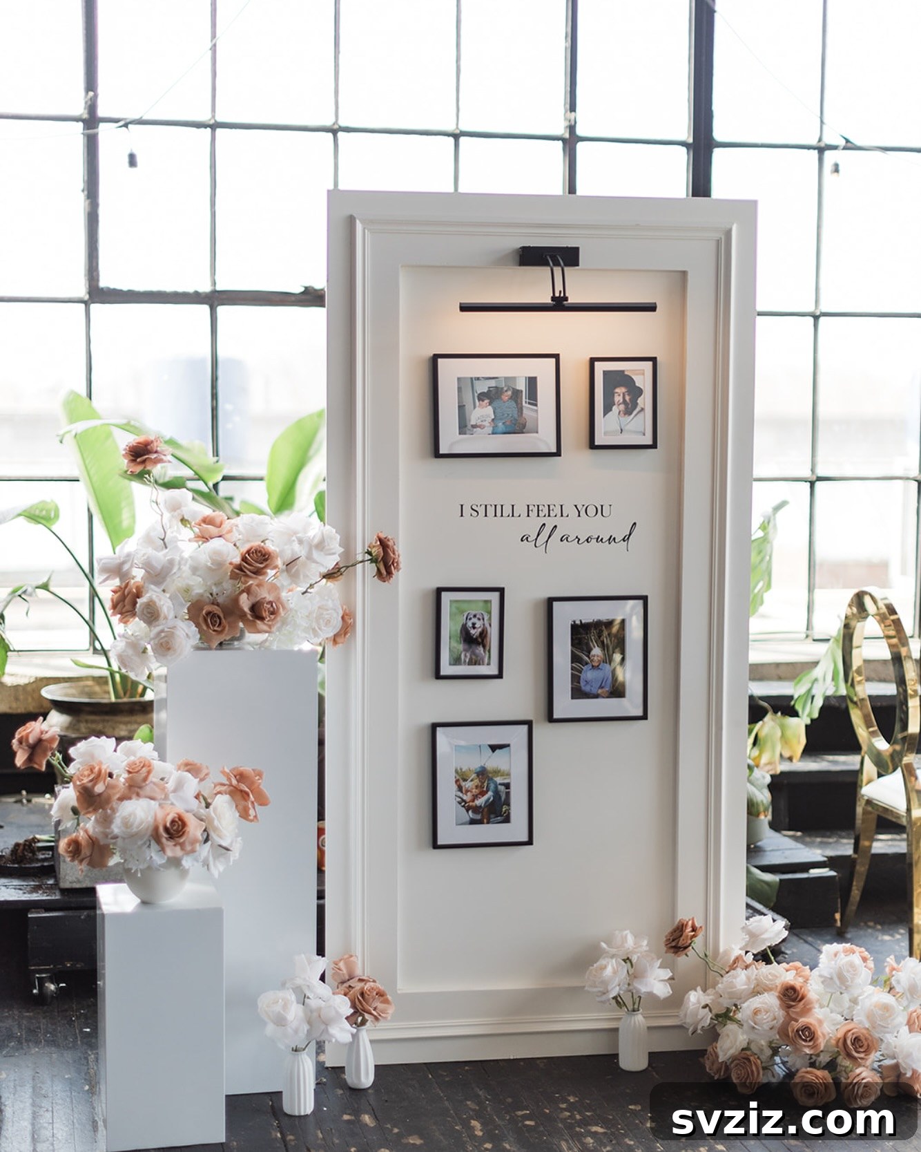 Elegant memorial arrangement with framed photos, lush flowers, and a sentimental quote.