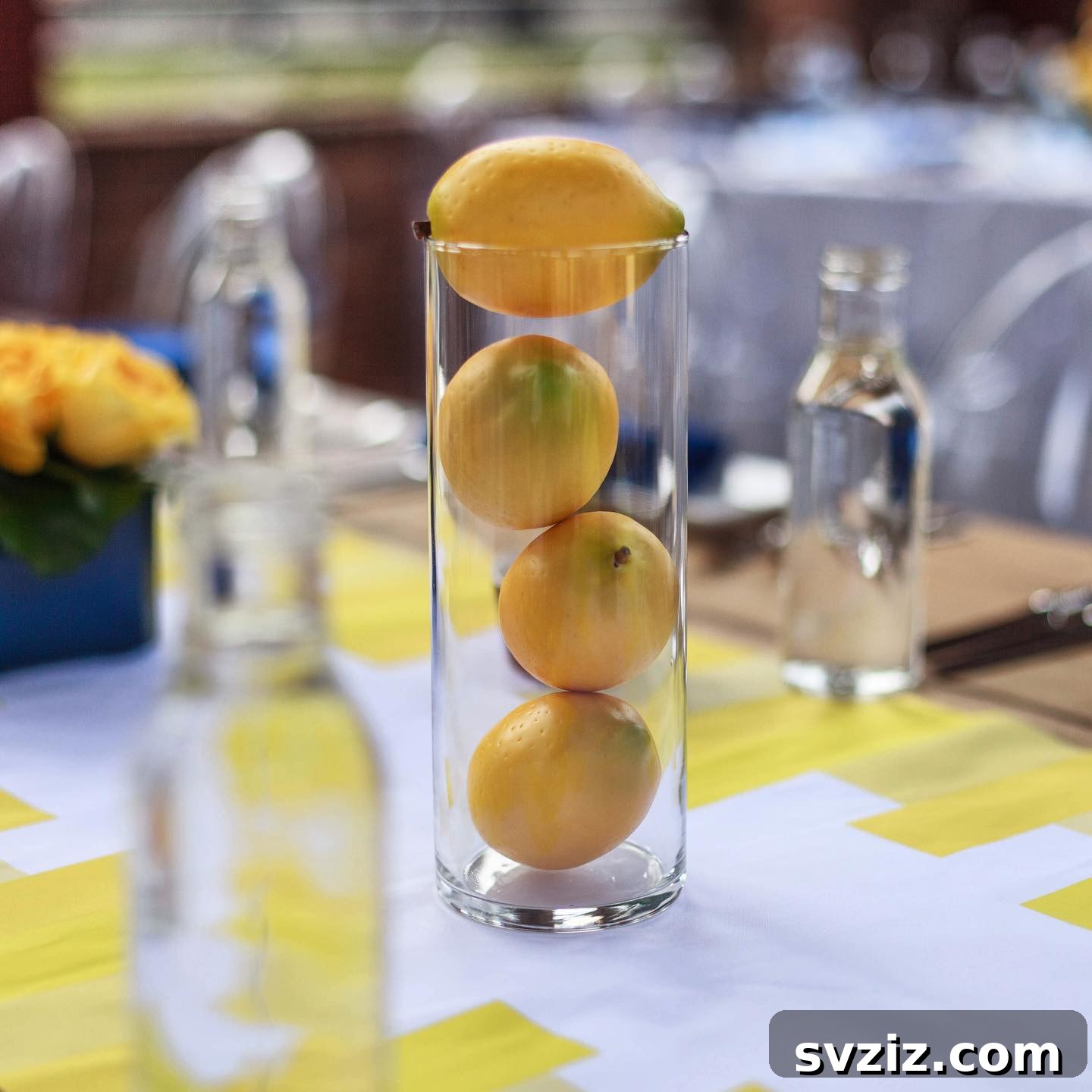 23 Effortless DIY Summer Dining Table Centerpieces 12 10. Simple Lemon Cylindrical Vase