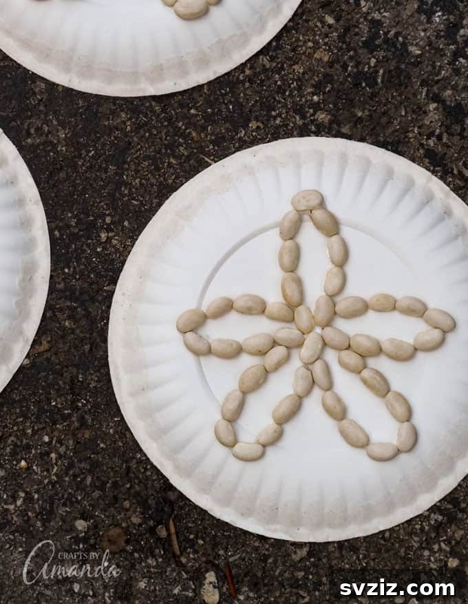 Elegant paper plate sand dollars, painted in off-white tones with intricate designs, perfect for beach-themed decor or gifts.