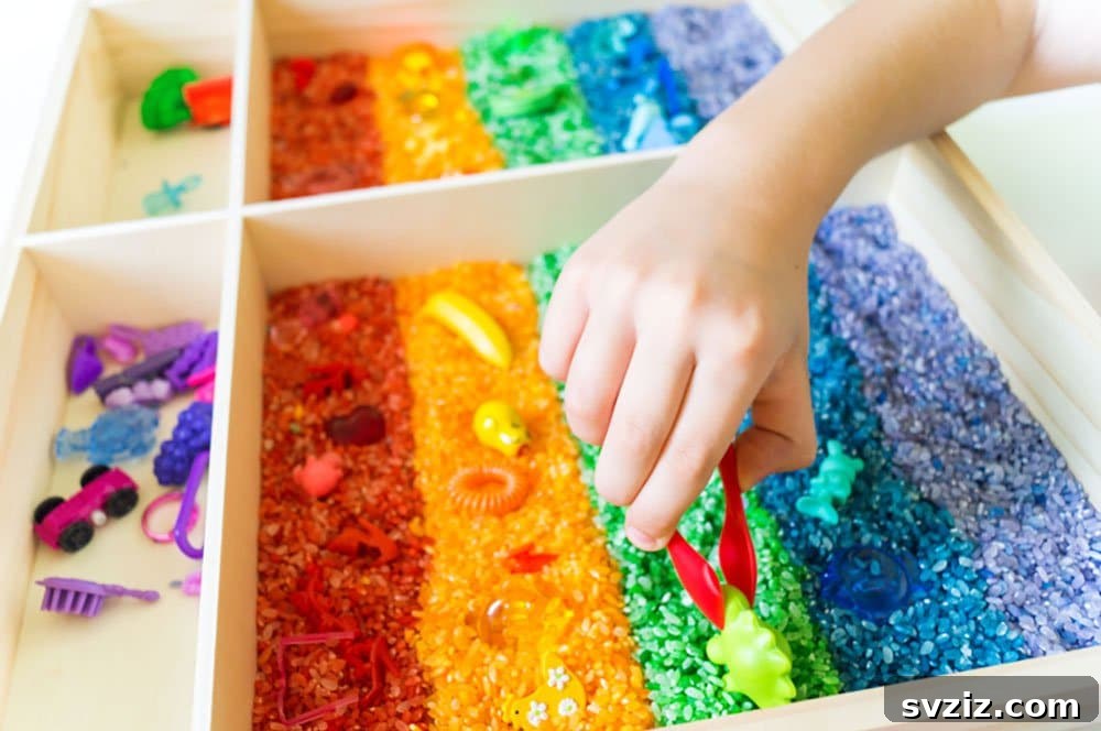 Vibrantly colored DIY rice in a sensory bin.
