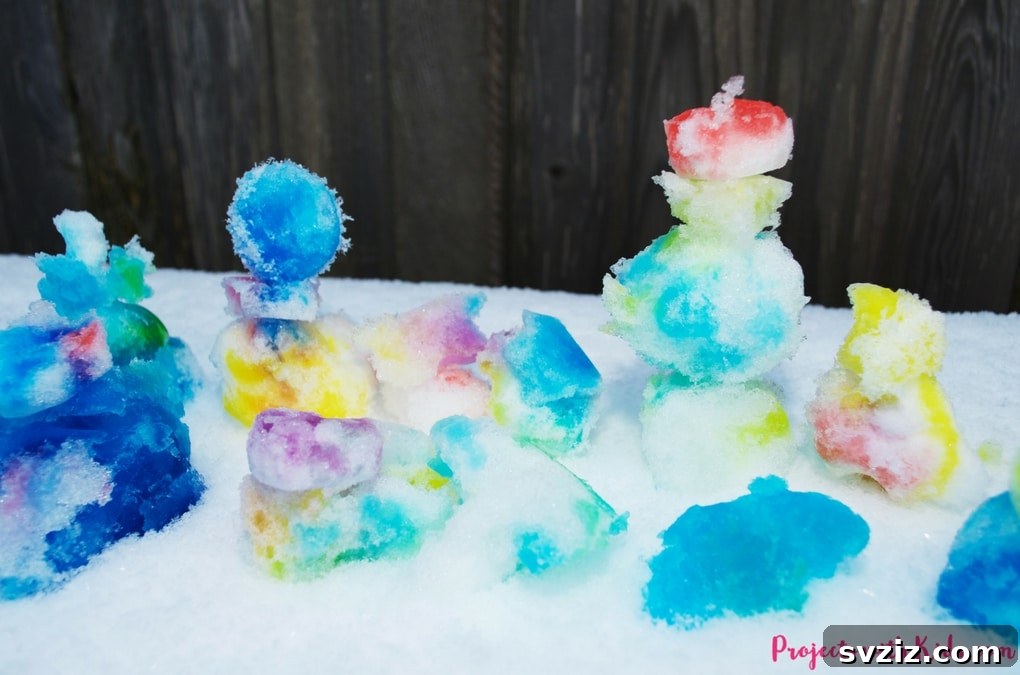 Colorful snow sensory painting activity outdoors.
