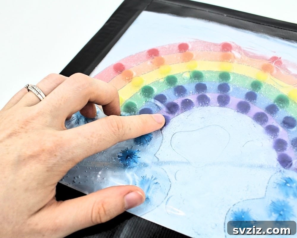 Colorful pom-pom rainbow sensory bag for visual and tactile play.