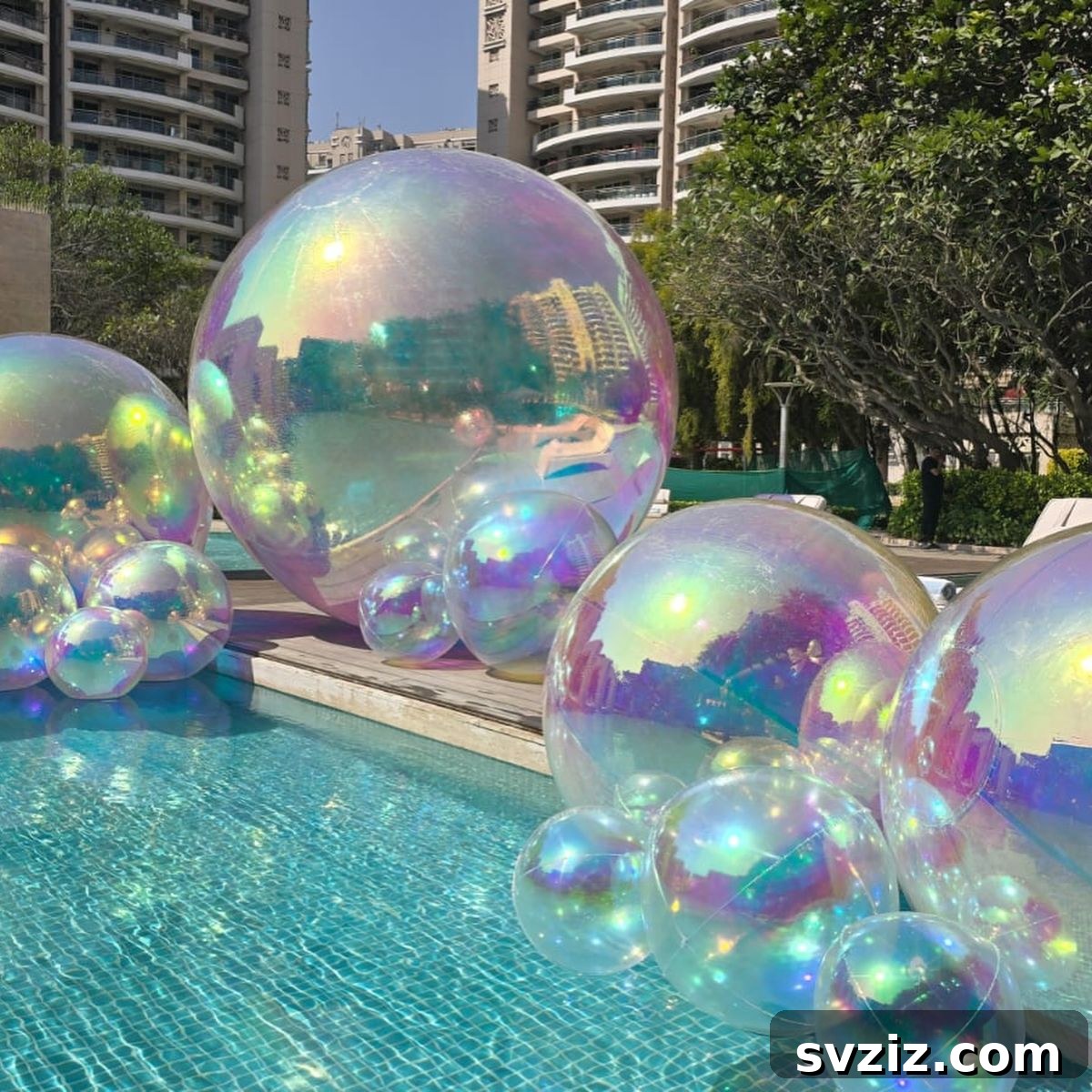 Splash into Summer: Creative Pool Party Ideas 12 Elegant poolside decor with shimmery bubbles.