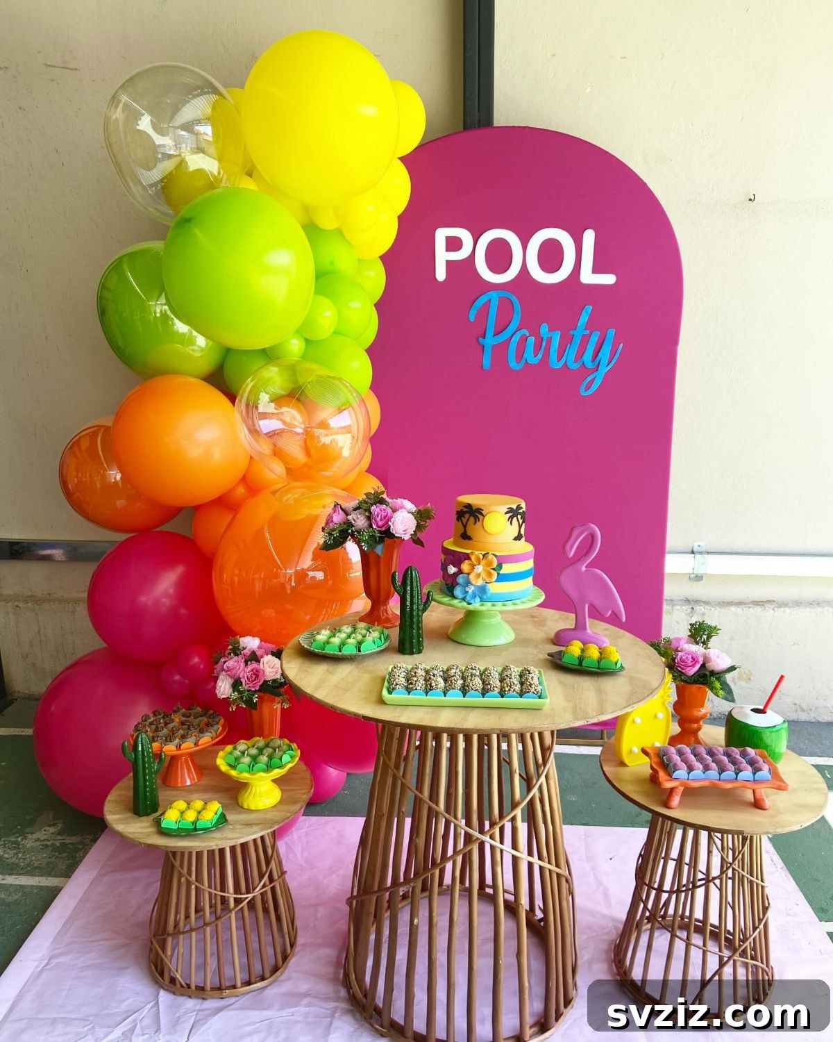 Splash into Summer: Creative Pool Party Ideas 17 Tropical-themed pool party dessert station with colorful balloons.