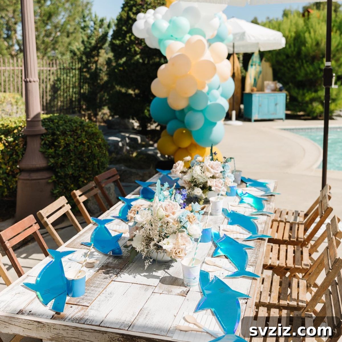 Splash into Summer: Creative Pool Party Ideas 23 Exciting shark-themed pool party with elegant decor.