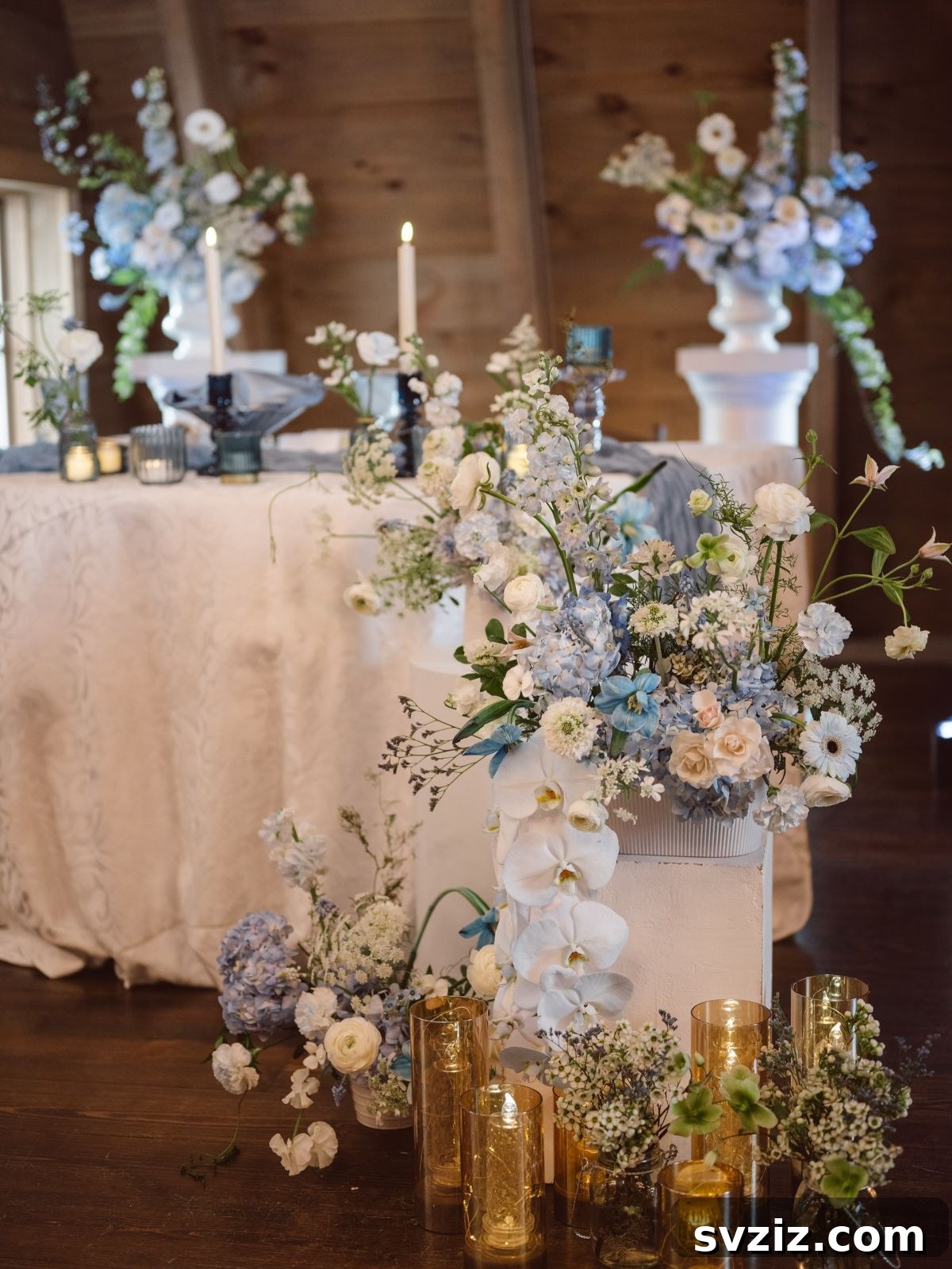 Stunning Summer Wedding Color Palettes 15 Elegant wedding tablescape with cool blue and white decor, shimmering vases, and refreshing ambiance