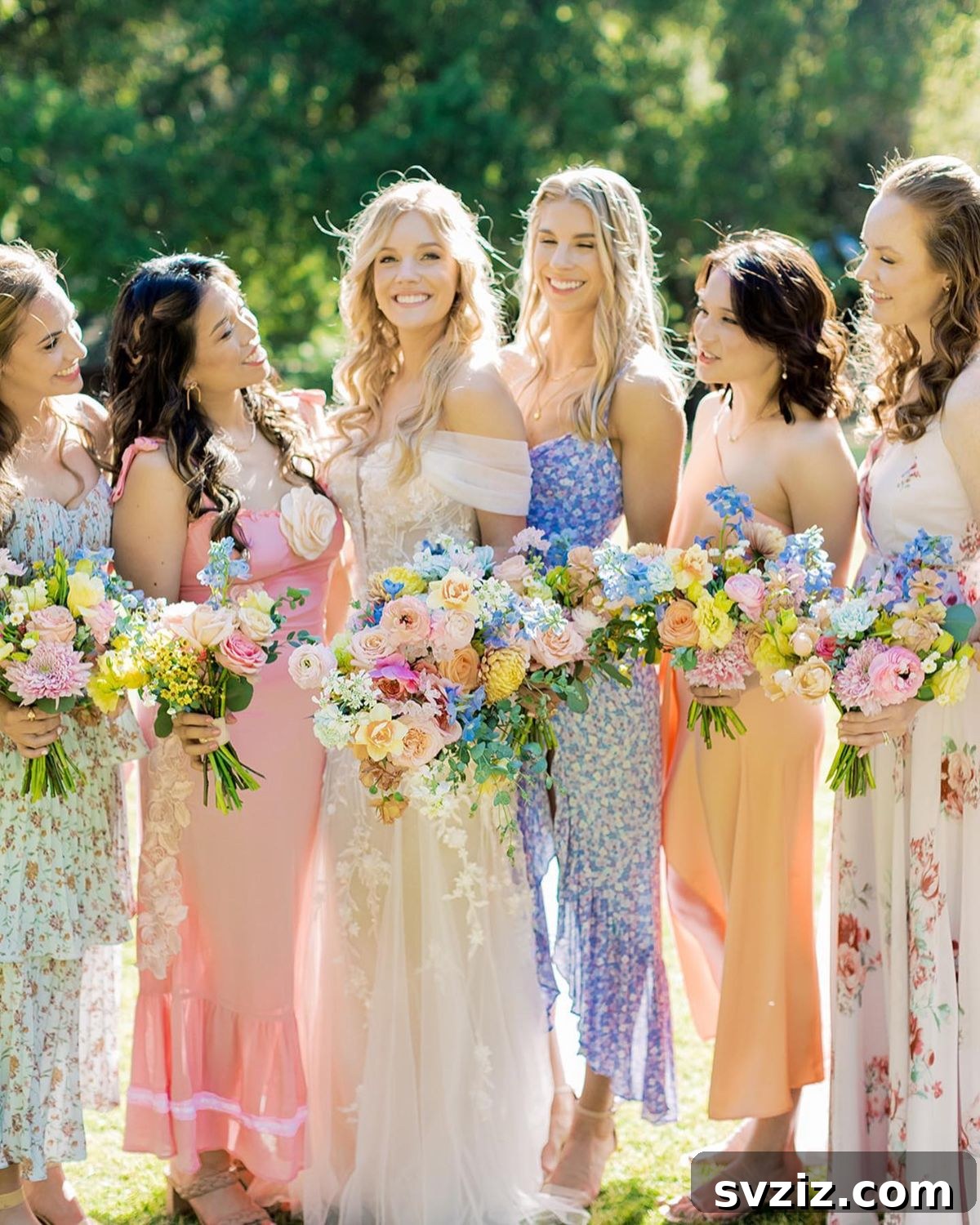 Stunning Summer Wedding Color Palettes 16 Stunning mismatched bridesmaid dresses in a vibrant array of blue, orange, and pink for a summer wedding