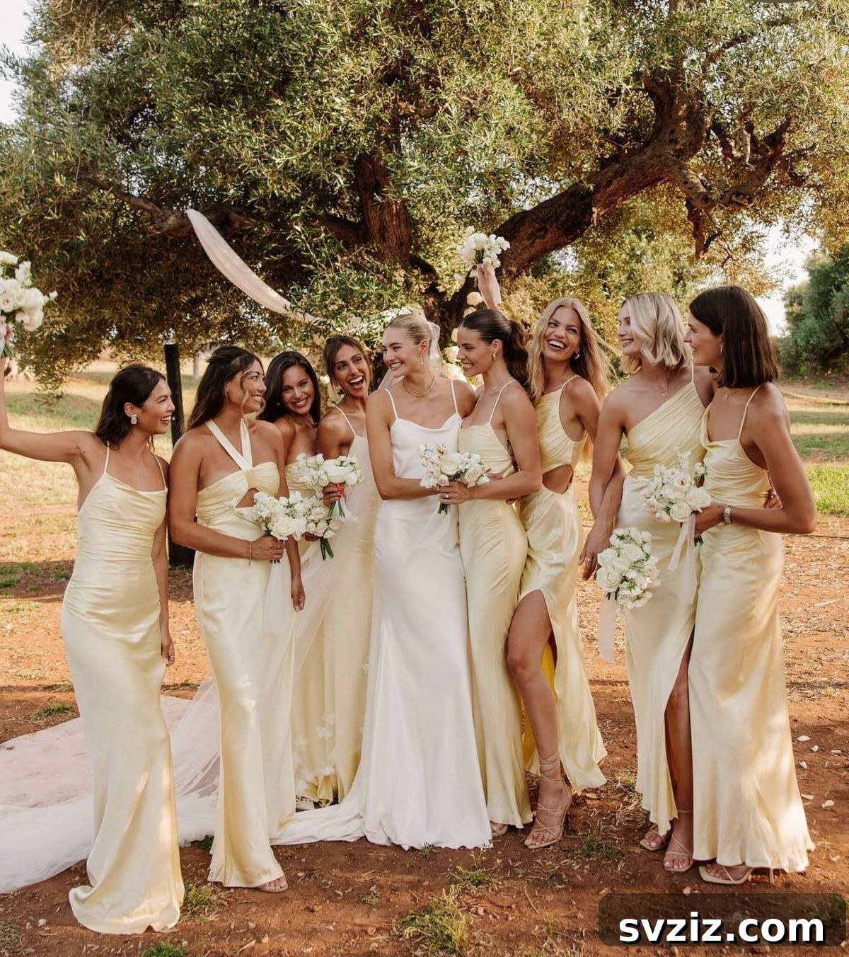Stunning Summer Wedding Color Palettes 18 Bridesmaids in elegant butter yellow dresses, creating a cheerful and photogenic summer wedding palette