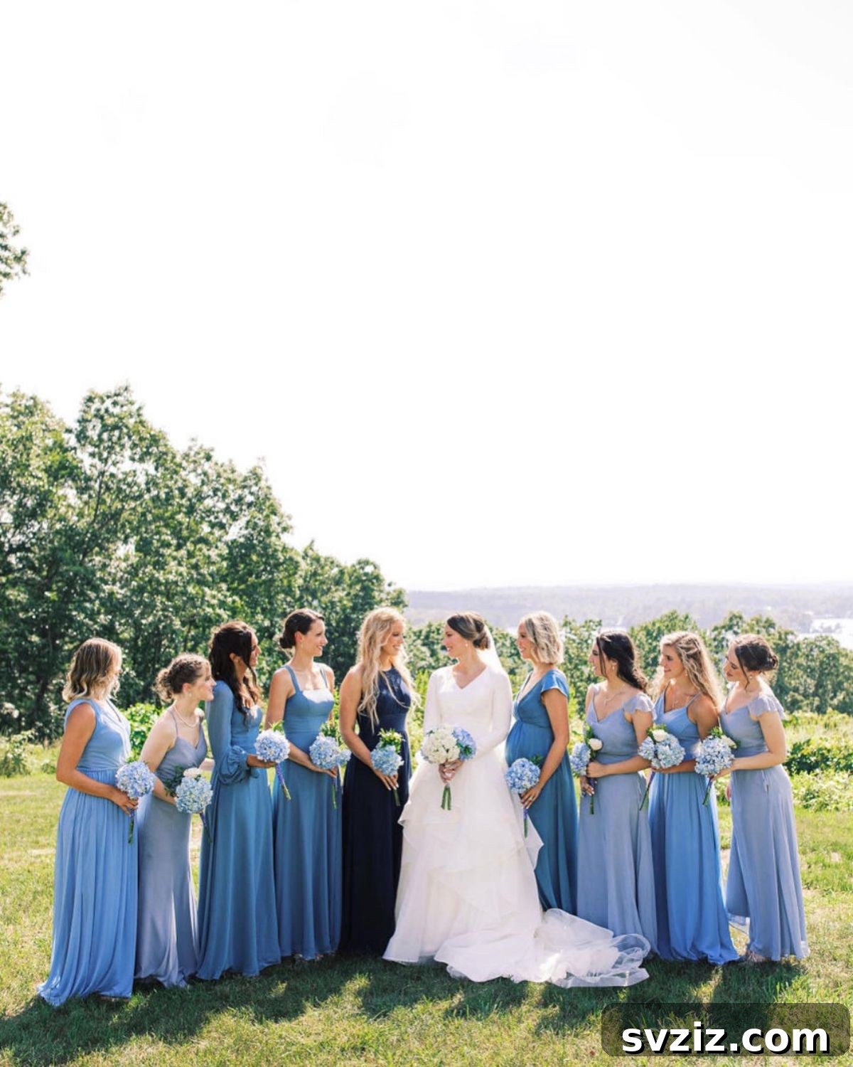 Stunning Summer Wedding Color Palettes 20 Bridesmaids in diverse shades of blue, including steel blue, dusty blue, and navy, for a captivating wedding palette
