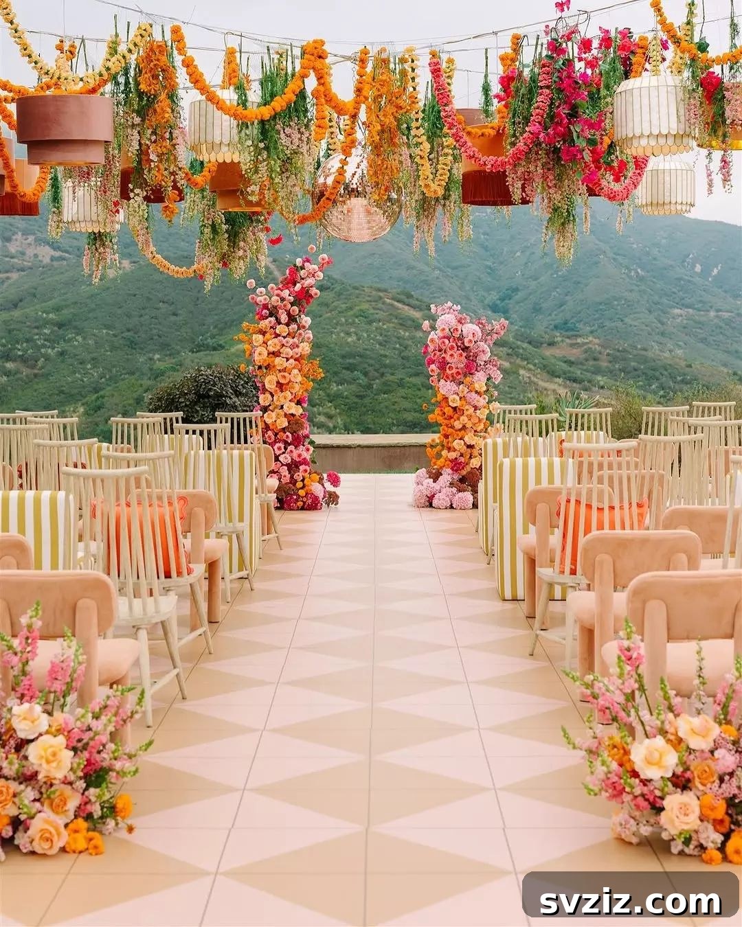 Stunning Summer Wedding Color Palettes 3 Vibrant floral centerpiece with bold pinks, oranges, and yellows for a summer wedding