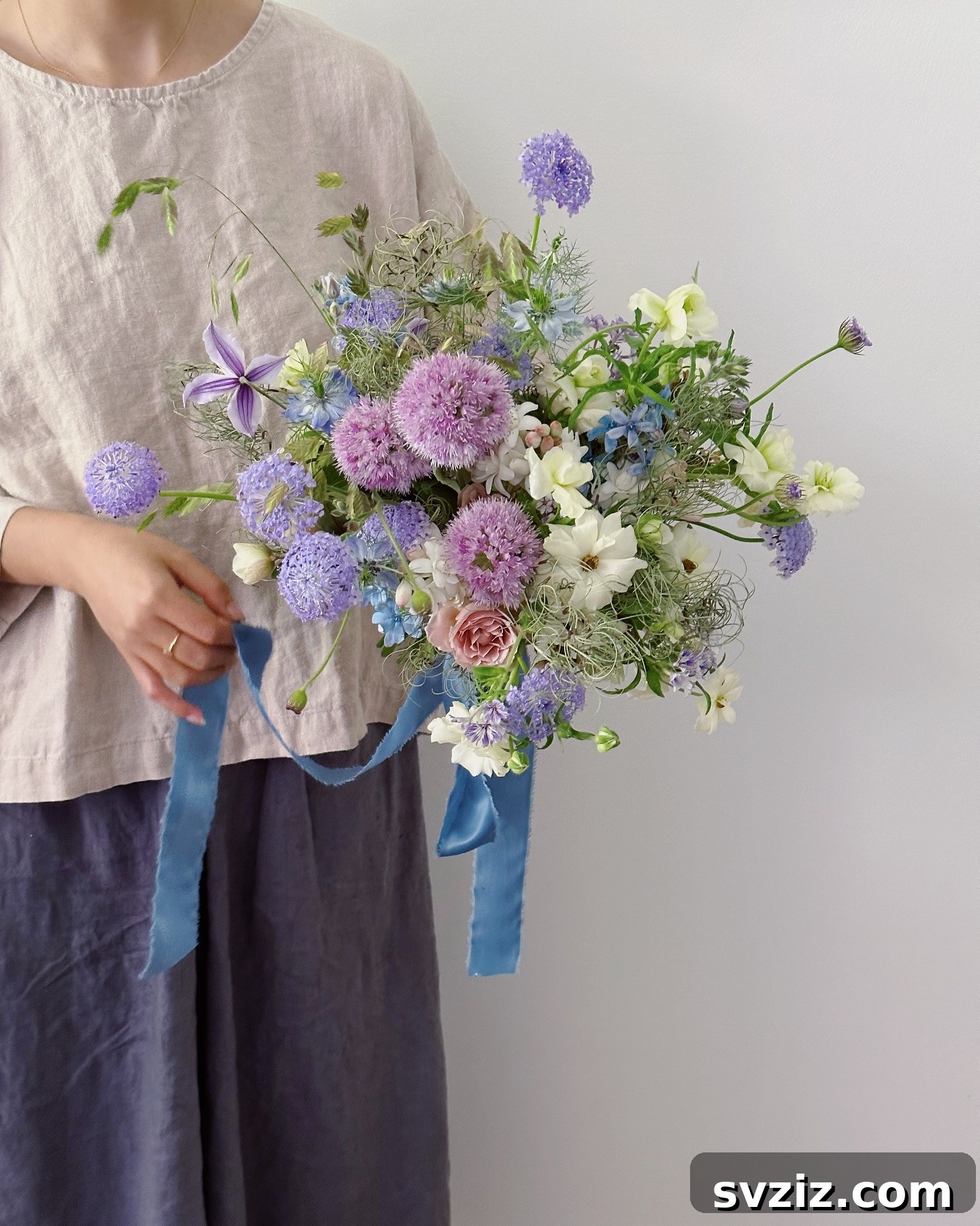 Stunning Summer Wedding Color Palettes 32 Vibrant wedding bouquet showcasing various shades of purple, an excellent choice for a summer wedding color scheme