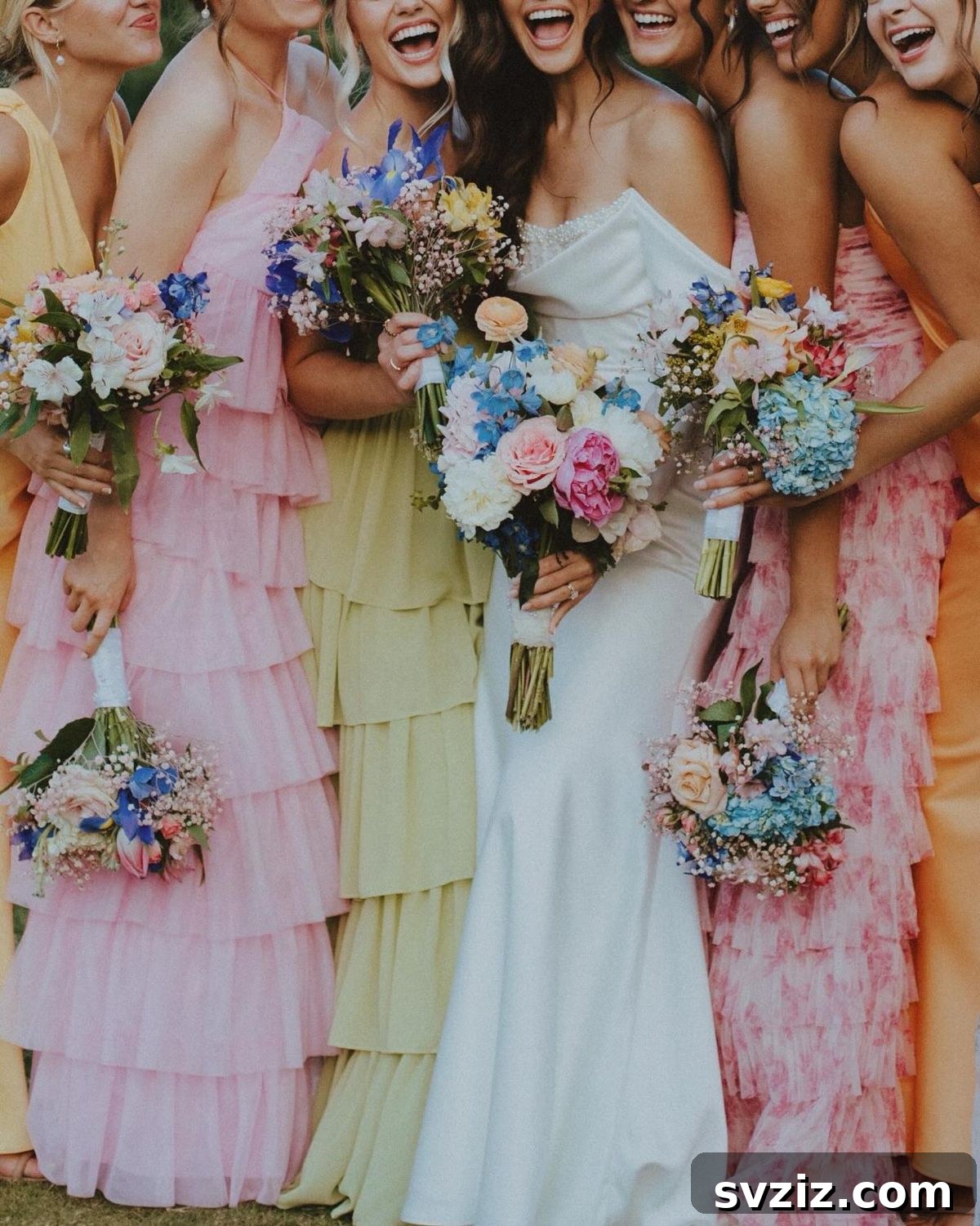 Stunning Summer Wedding Color Palettes 7 Vibrant mix-and-match bridesmaid dresses in white, blue, pink, and yellow for a cheerful summer wedding