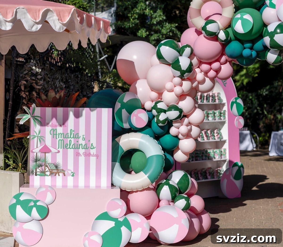 Pink and green striped balloon arrangement inspired by the iconic Beverly Hills Hotel aesthetic.