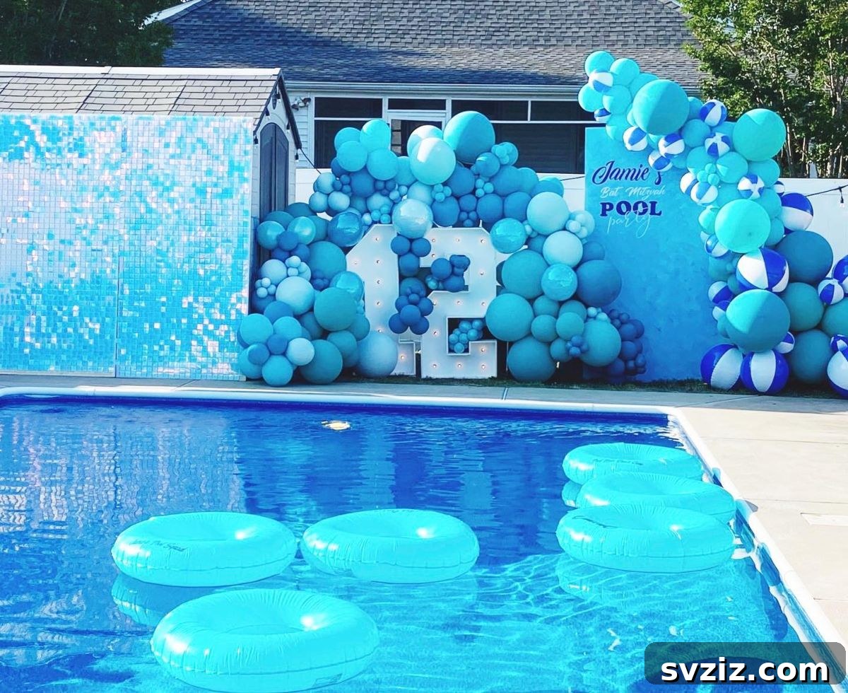 All blue balloon setup with turquoise inflatables, creating an immersive water-themed pool party decor.