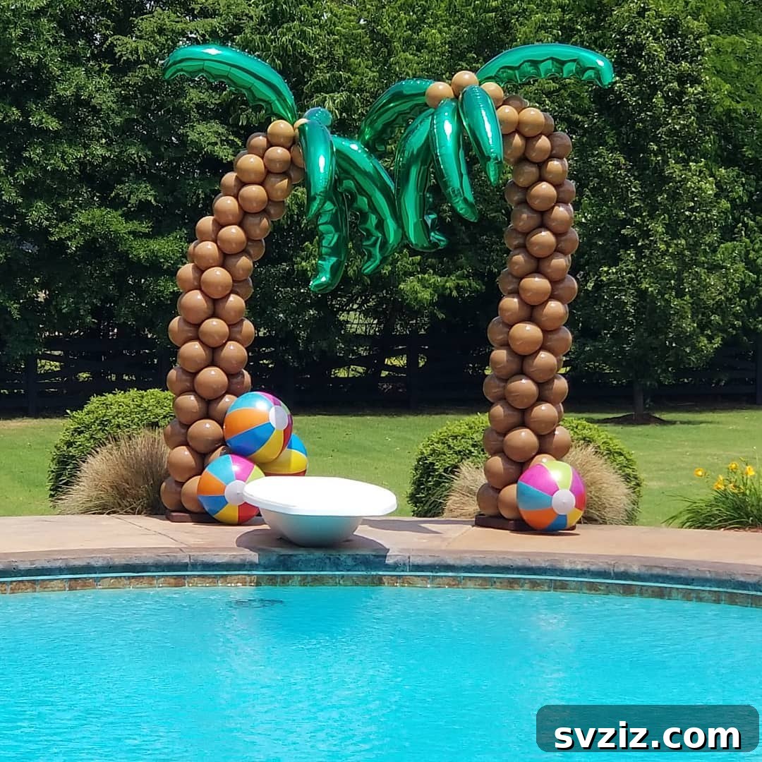 Stunning tropical balloon display featuring palm trees, perfect for a relaxed pool party vibe.