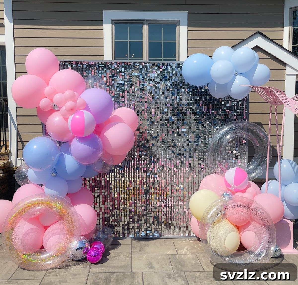 Pink, purple, and blue balloons with a gorgeous sequined backdrop for a glamorous pool party.