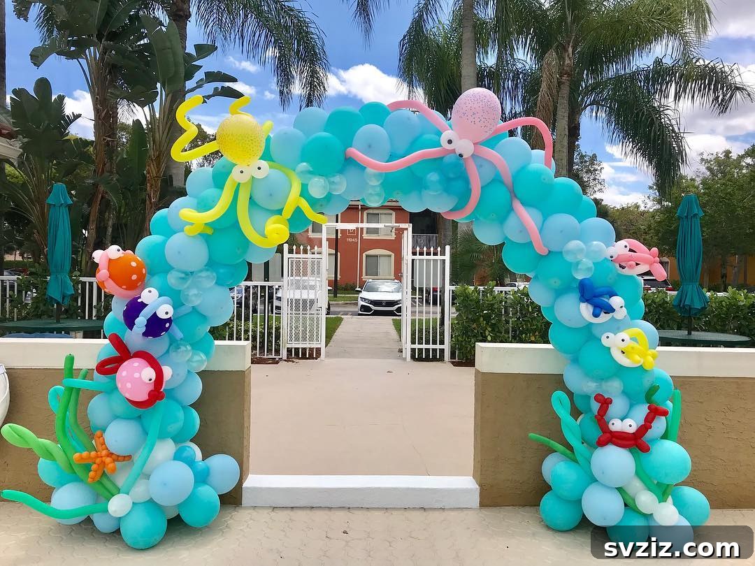Delightful sea creatures balloon arch featuring octopuses, crabs, and baby sharks for a kids' pool party.
