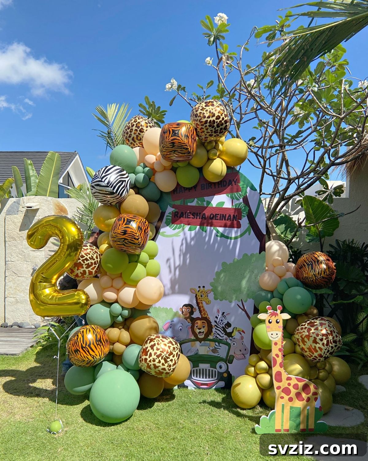 Safari-themed balloon display with giraffe cut-outs and leopard print elements for a wild pool party.