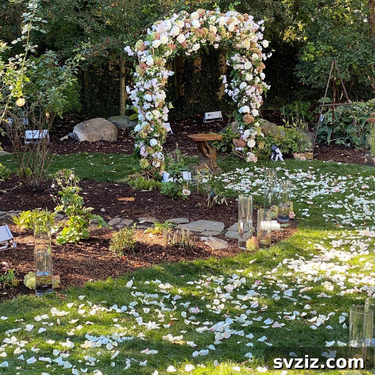 23 Dreamy Backyard Micro Wedding Concepts 11 Wedding ceremony arch overflowing with lush flowers and greenery