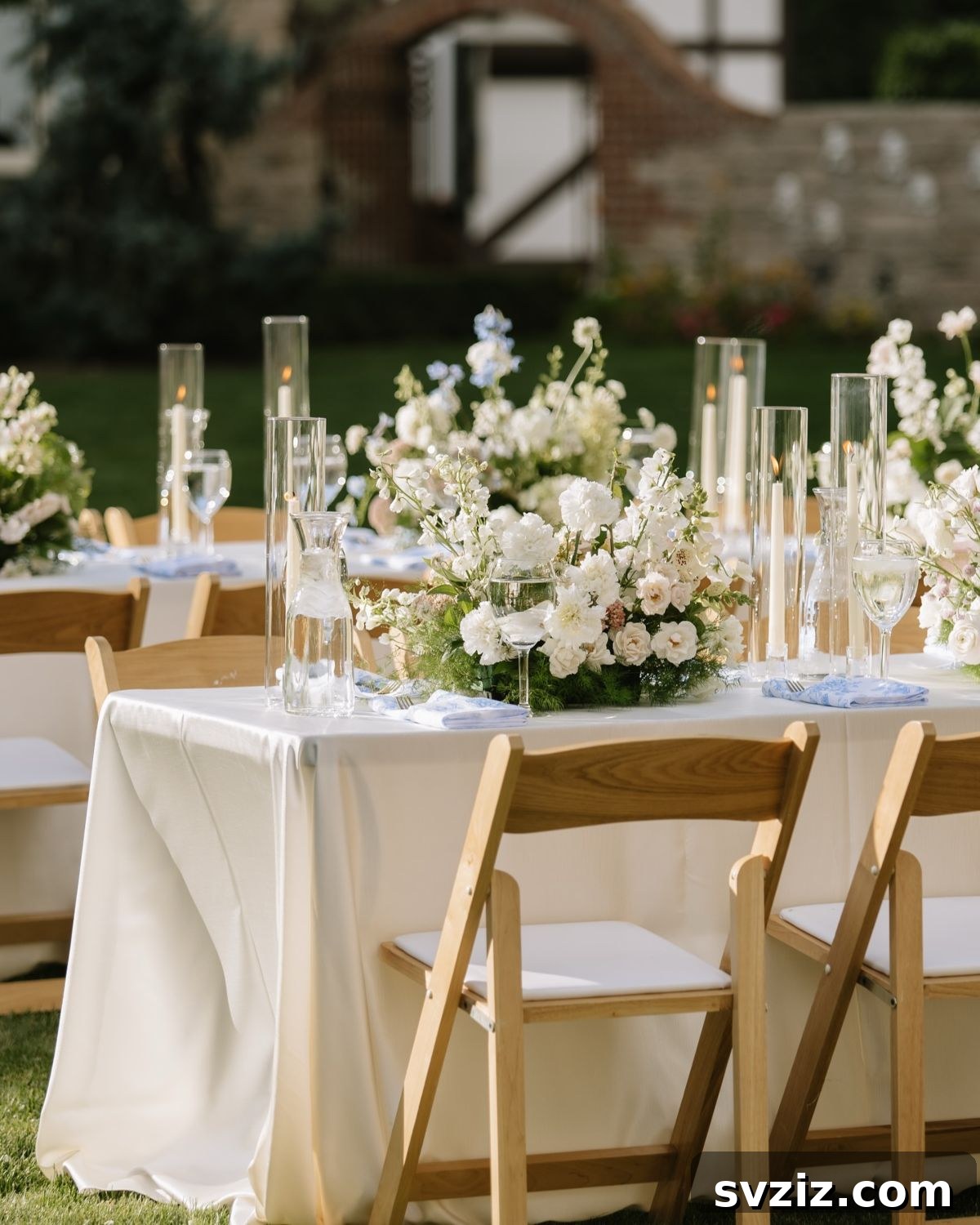 23 Dreamy Backyard Micro Wedding Concepts 16 Classic and elegant wedding tablescape with tall cylindrical vases
