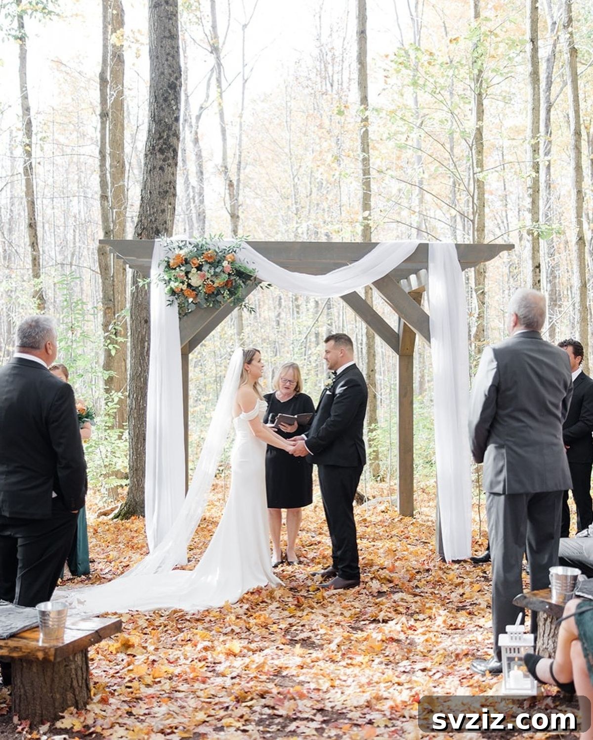 Warm Fall Backyard Wedding Inspirations 3 1. Floral Arch in the Woods