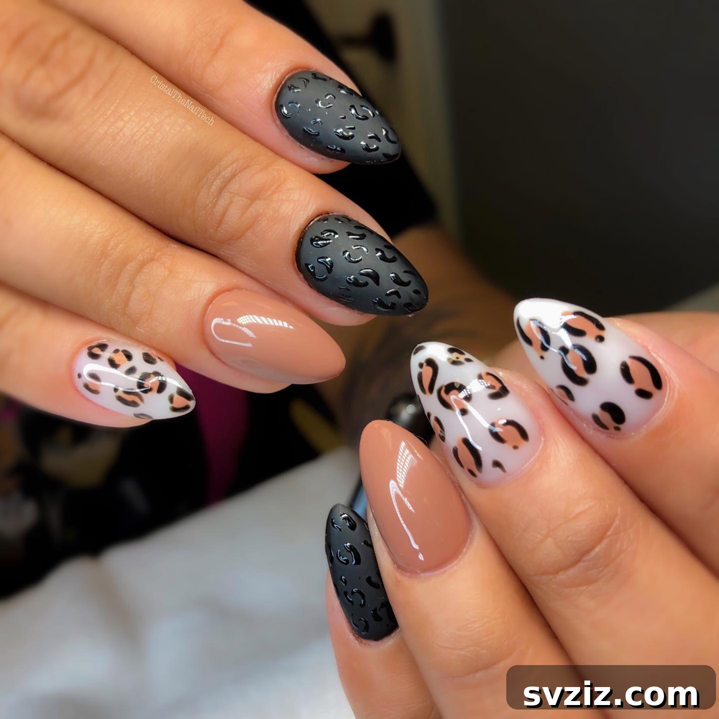 Stylish Chic and Fun Almond Nails with Leopard and Black Designs