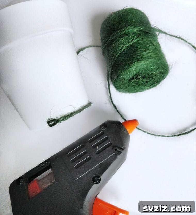 Green twine with flower pot and hot glue application