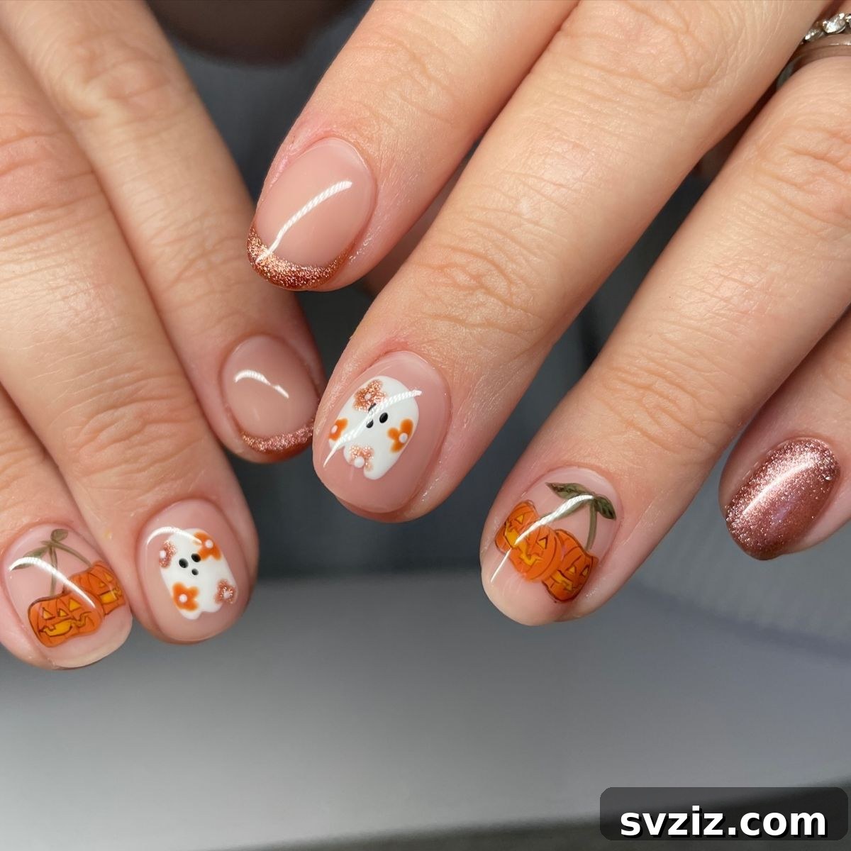 23 Hottest Autumn Nail Trends to Inspire You 17 Nude Nails with Sparkles and Cute Halloween Designs