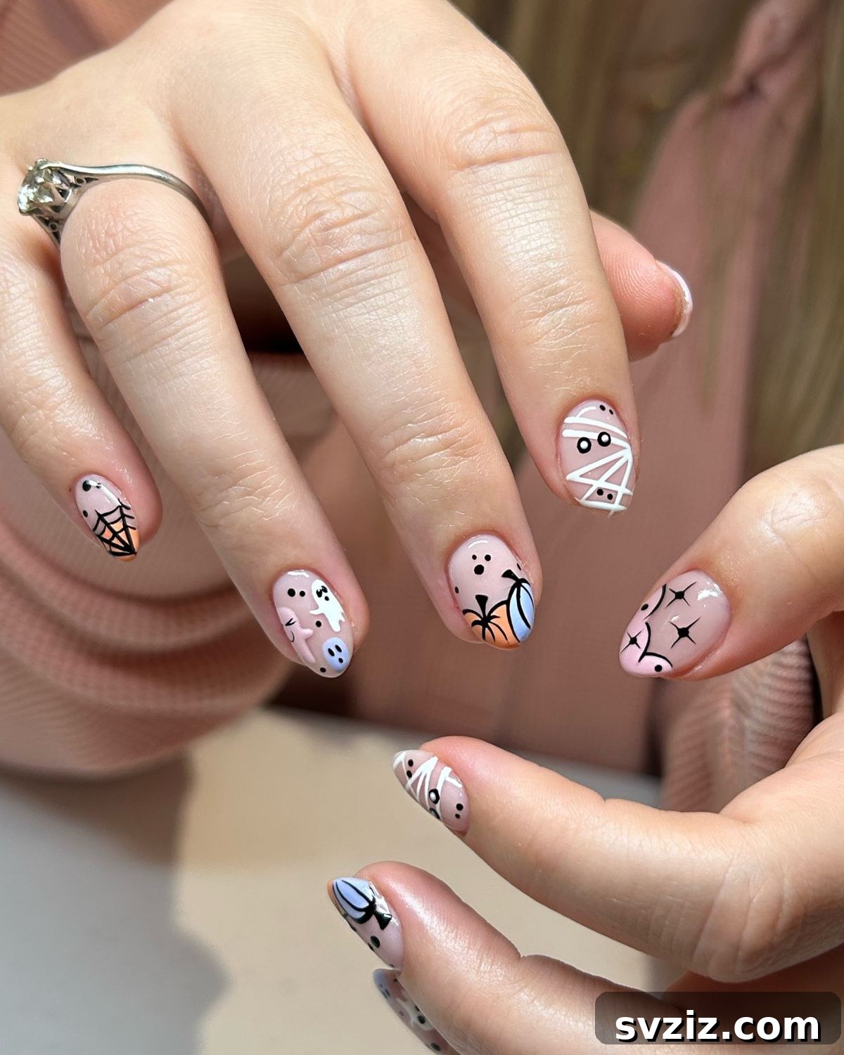 23 Hottest Autumn Nail Trends to Inspire You 4 Halloween Pastel Nail Designs with Spiderwebs and Pumpkins