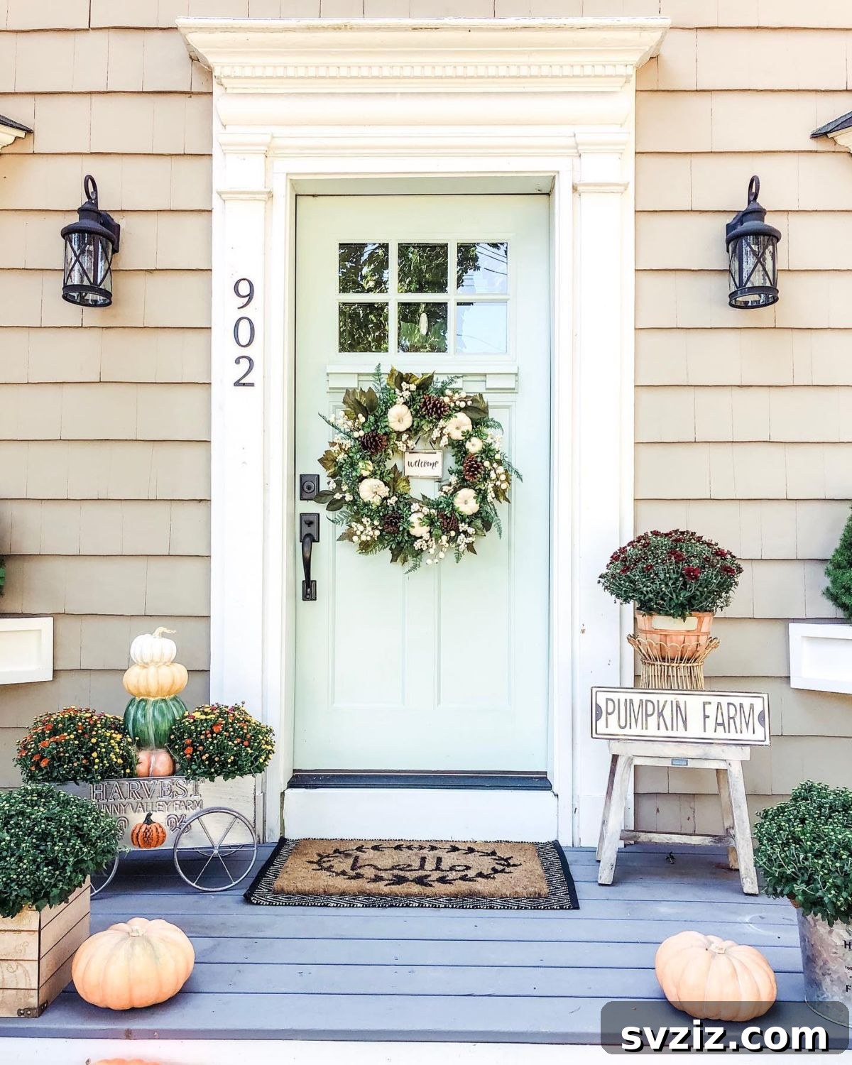 31 Autumn Outdoor Decor Ideas to Enhance Your Home's Curb Appeal 12 Charming pumpkin farm themed porch with a vintage wagon and fall florals