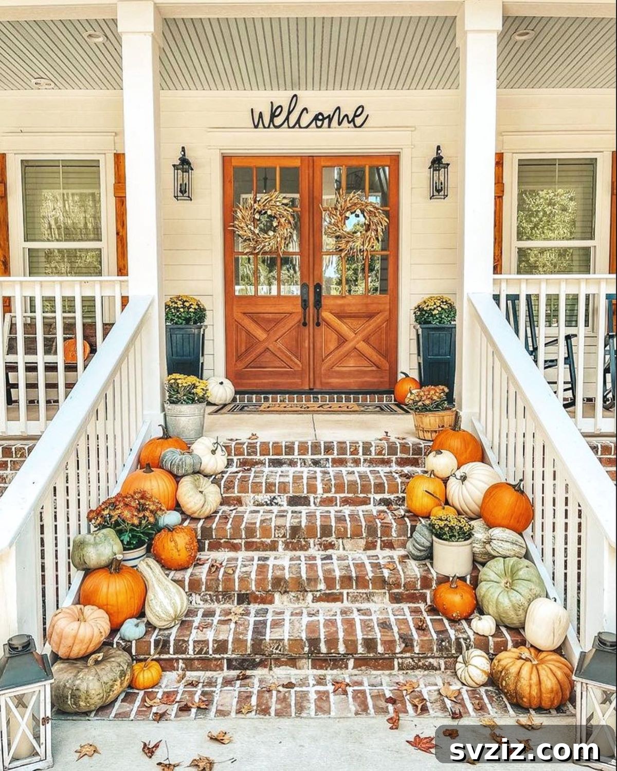 31 Autumn Outdoor Decor Ideas to Enhance Your Home's Curb Appeal 15 Gorgeous and welcoming fall porch with pumpkin-lined steps, eye-catching wreaths, and simple flowers