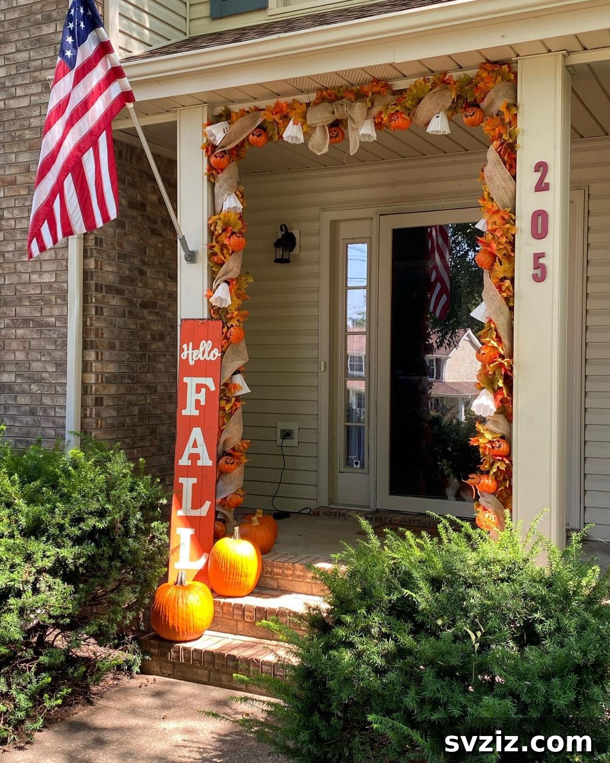 31 Autumn Outdoor Decor Ideas to Enhance Your Home's Curb Appeal 17 Stunning fall porch entranceway decorated with pumpkins, leaves, and bows