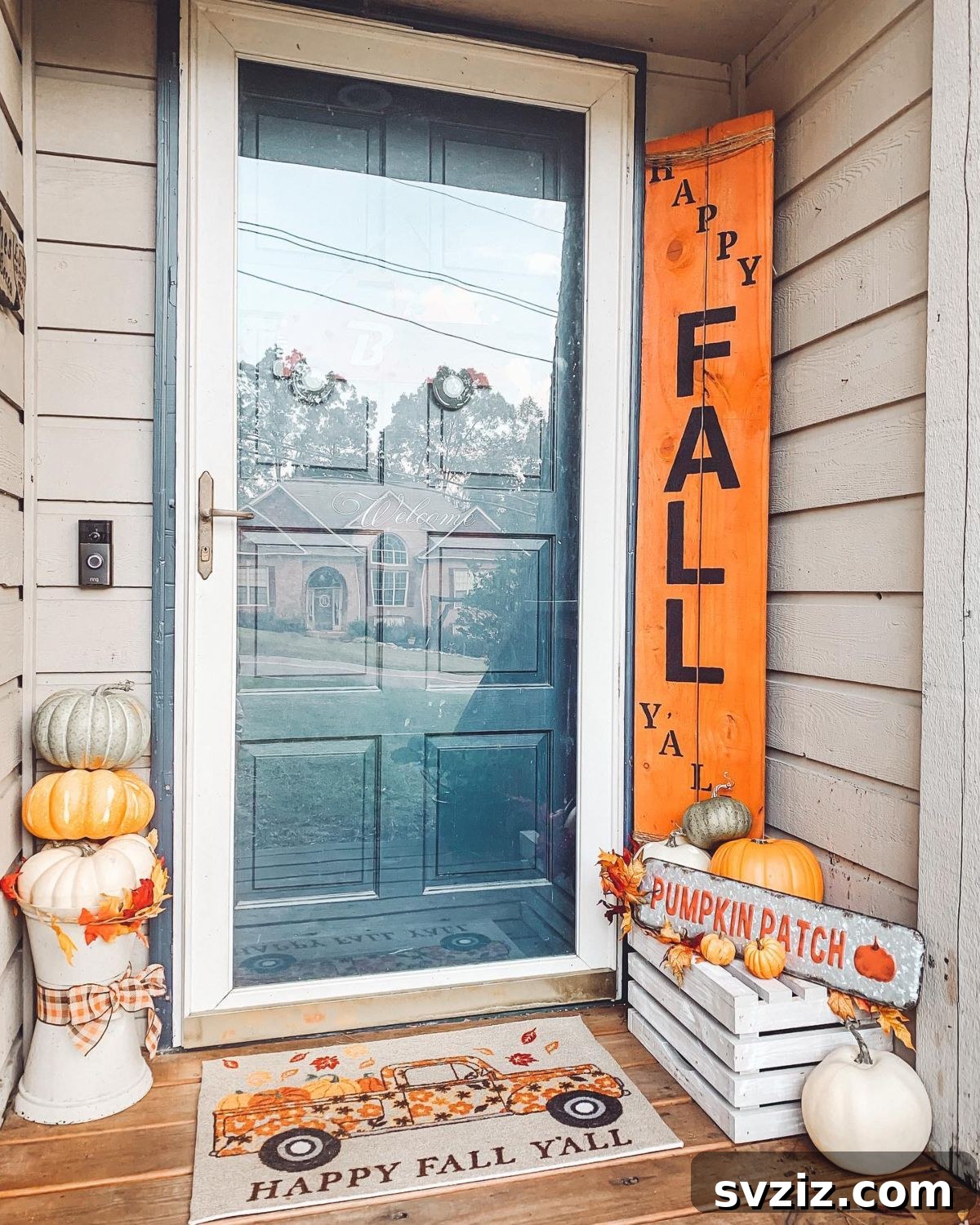 31 Autumn Outdoor Decor Ideas to Enhance Your Home's Curb Appeal 20 Charming rustic pumpkin patch themed porch with a pumpkin tower, plaid ribbon, and crate decor