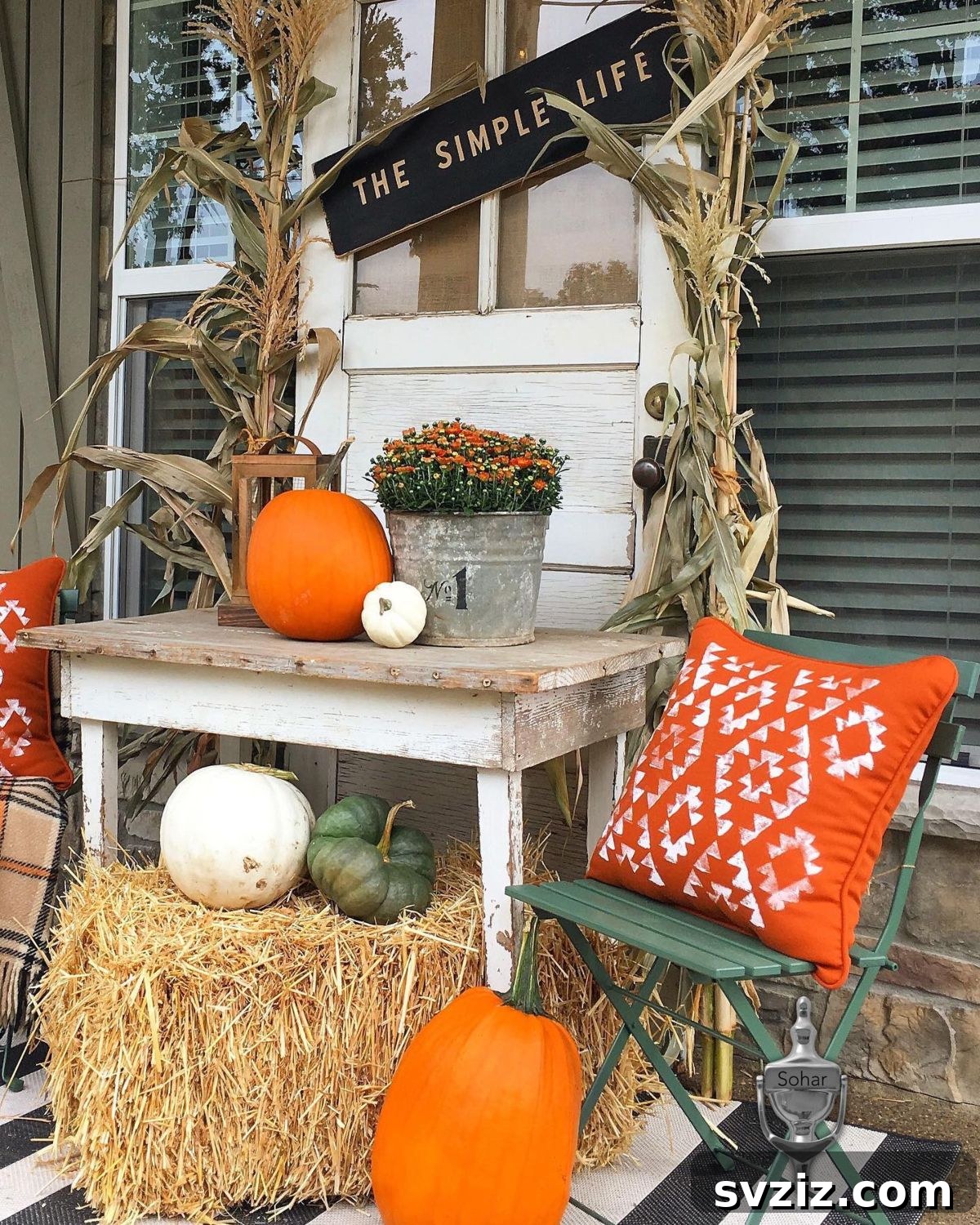 31 Autumn Outdoor Decor Ideas to Enhance Your Home's Curb Appeal 24 Rustic porch sign celebrating 'The Simple Life' with fall decor