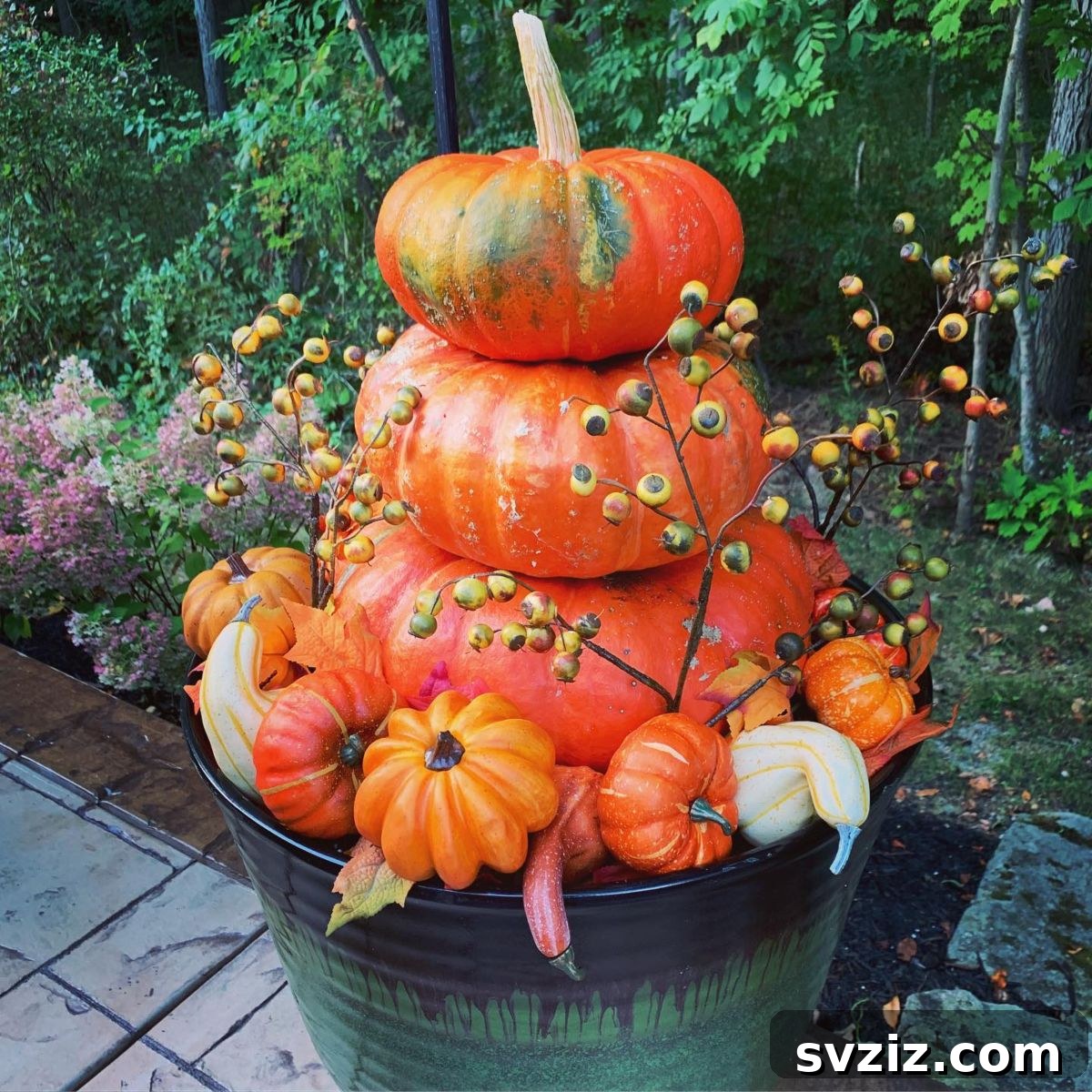 31 Autumn Outdoor Decor Ideas to Enhance Your Home's Curb Appeal 6 Adorable pumpkin bucket display with various pumpkin sizes and colors