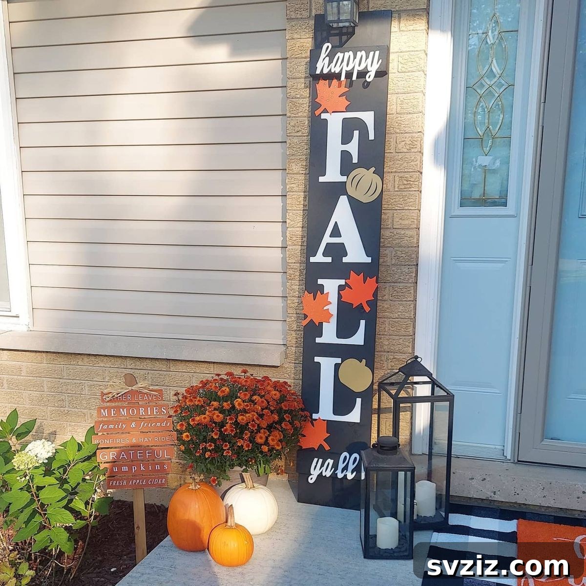 31 Autumn Outdoor Decor Ideas to Enhance Your Home's Curb Appeal 10 Simple and cheerful fall porch with orange flowers, pumpkins, and a 'Happy Fall, Y'all!' sign