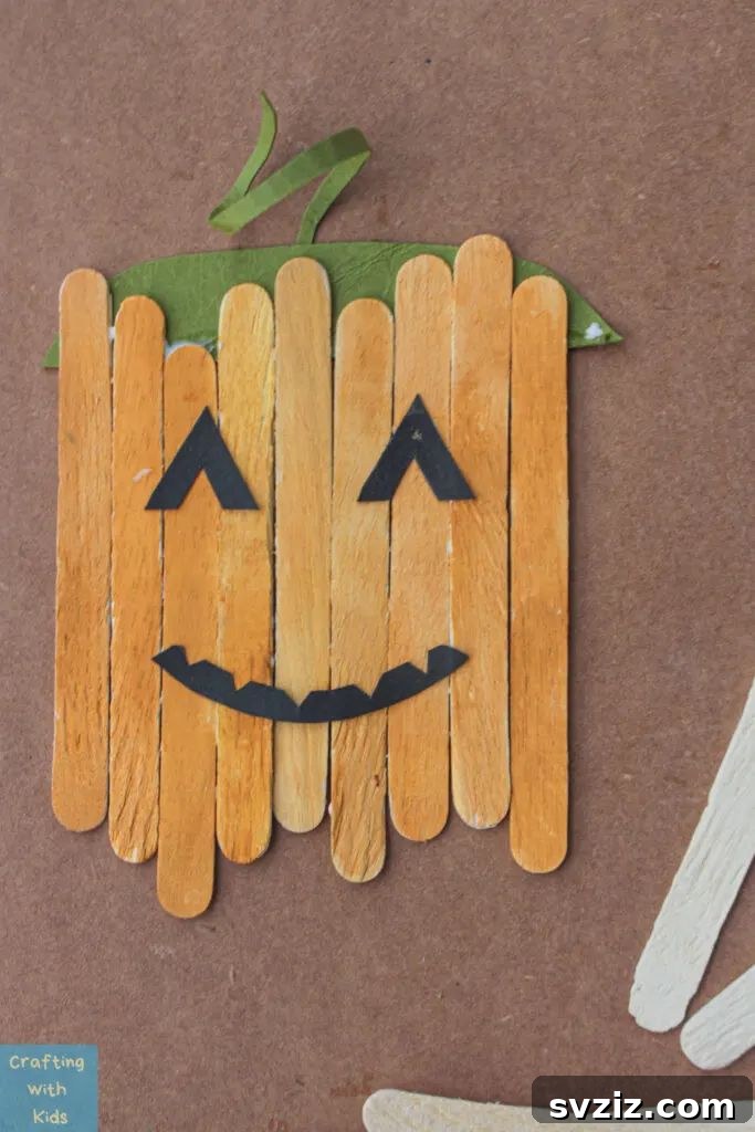 27 Delightful Autumn Crafts for Little Ones 15 Adorable Popsicle Stick Pumpkins fall craft for toddlers