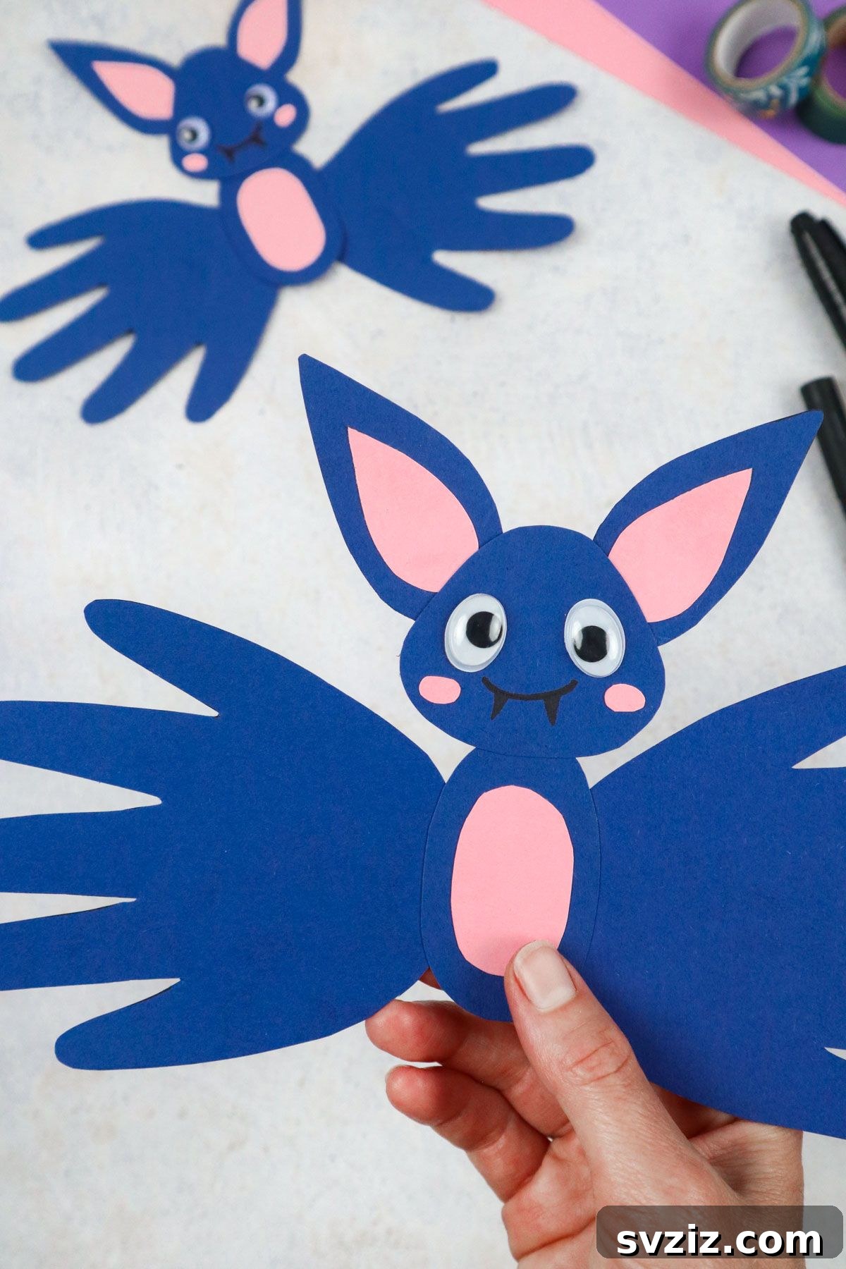 27 Delightful Autumn Crafts for Little Ones 4 Easy Handprint Bats craft for Halloween fun