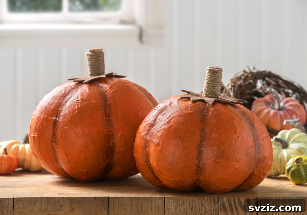 31 Chic Fall DIY Projects for Adult Homes 26 Handmade DIY paper mache pumpkins, a creative and customizable fall decoration.