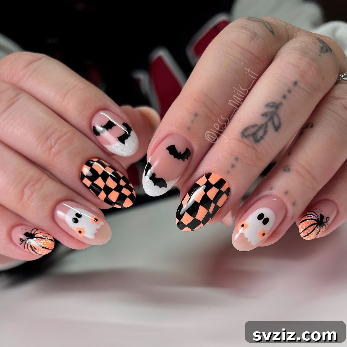 12. Orange Checkered Nails and Halloween Art