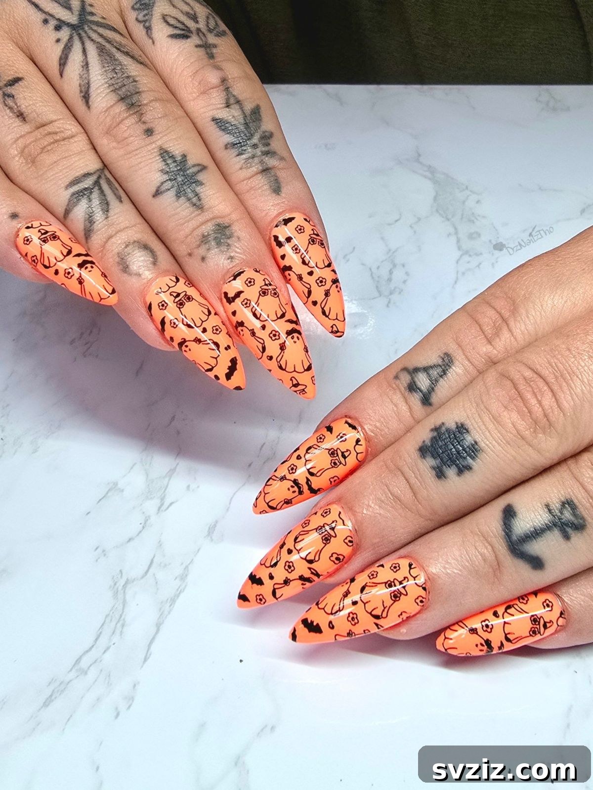 16. Creepy Cute Orange Nails