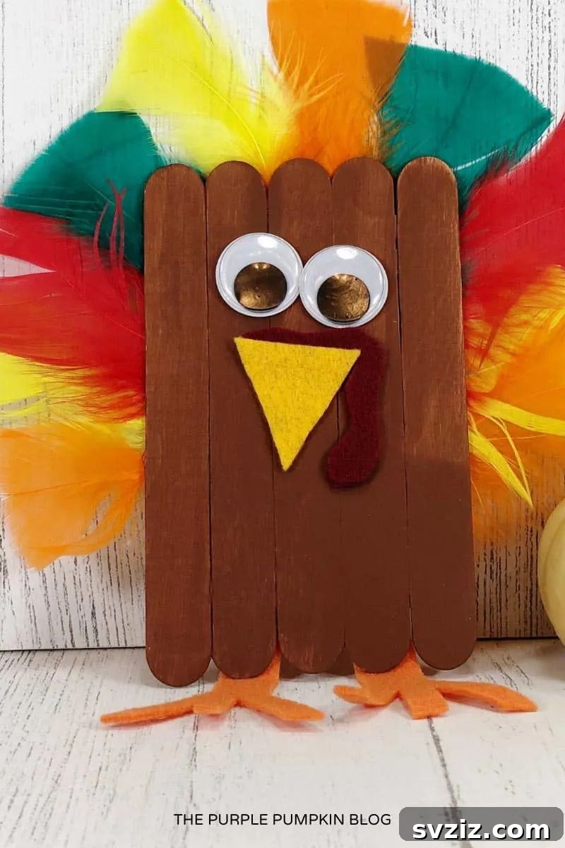 Kids' Craft Stick Turkey made with popsicle sticks and colorful decorations