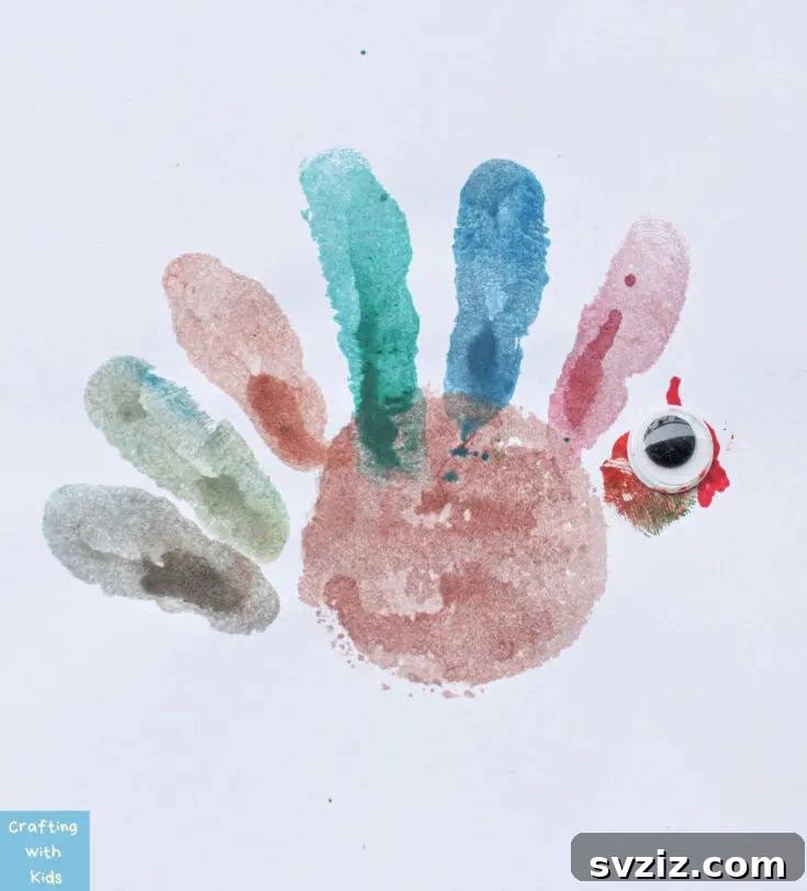 Thanksgiving Turkey Handprint craft with googly eyes for a memorable keepsake