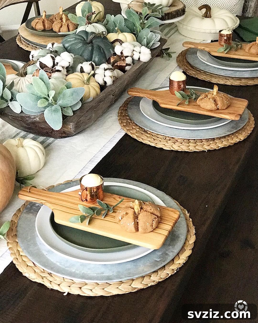 Craft the Perfect Feast: 21 DIY Thanksgiving Tablescapes 19 Individual servings of pumpkin rolls and butter on rustic mini wood boards, adding charm and coziness to each Thanksgiving place setting.