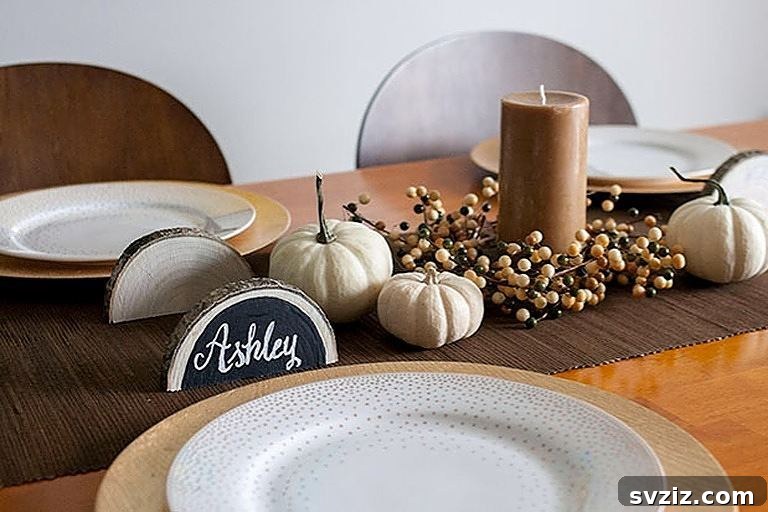 Craft the Perfect Feast: 21 DIY Thanksgiving Tablescapes 5 Rustic wood slice place cards adorned with autumn leaves and natural elements, perfect for a cozy Thanksgiving table.